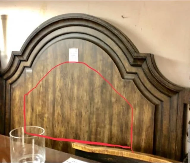Arched wood chair back marked for a shaped upholstery insert before restoration