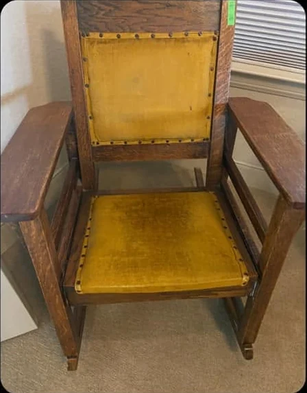 Vintage wood armchair with worn mustard back and seat panels before upholstery work